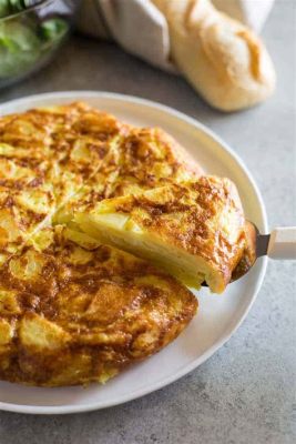 Tortilla de Patatas: Una Esplosione di Sapori Autentici con una Crosta Dorata e Cremosa!